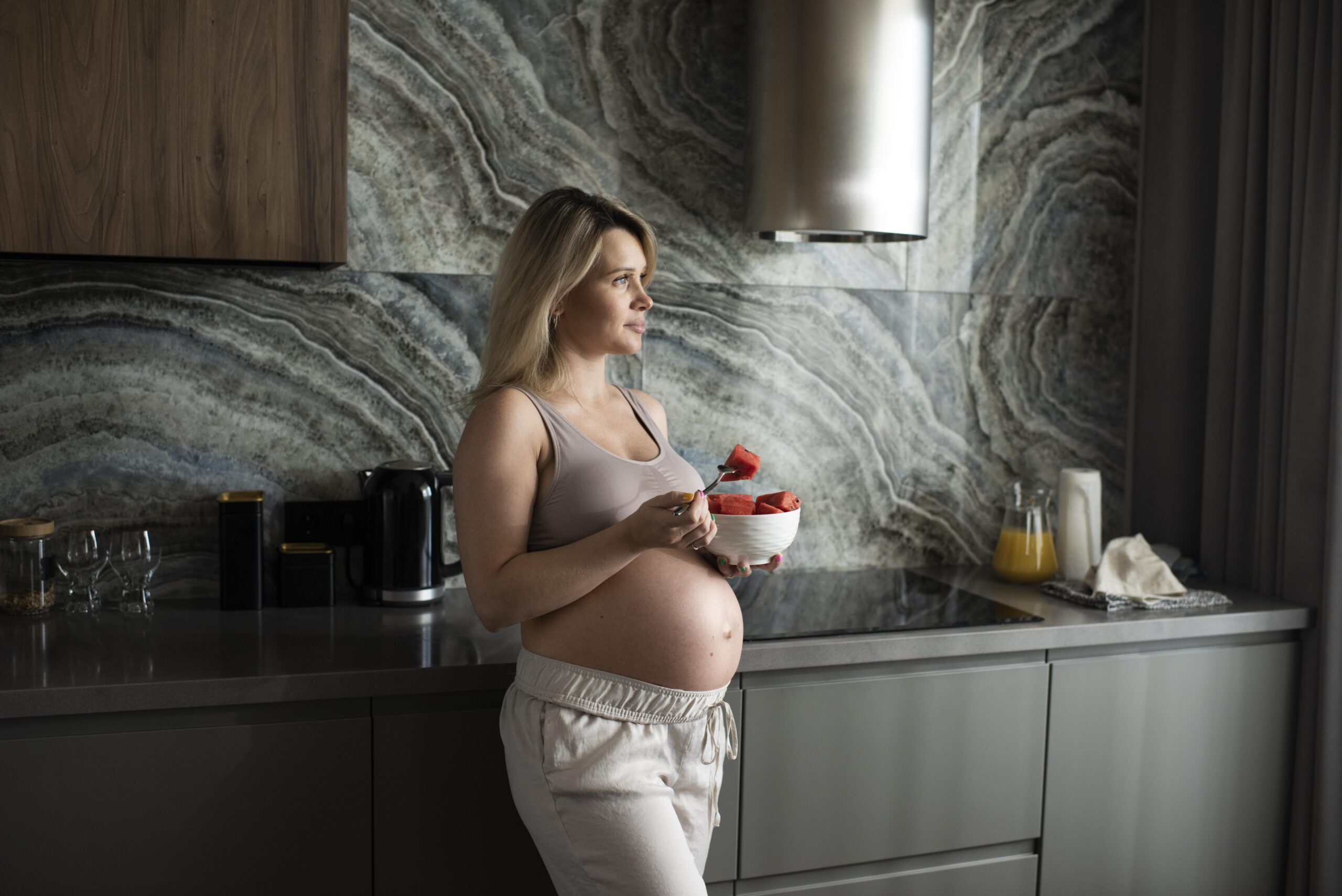 pregnant woman with fruit bowl